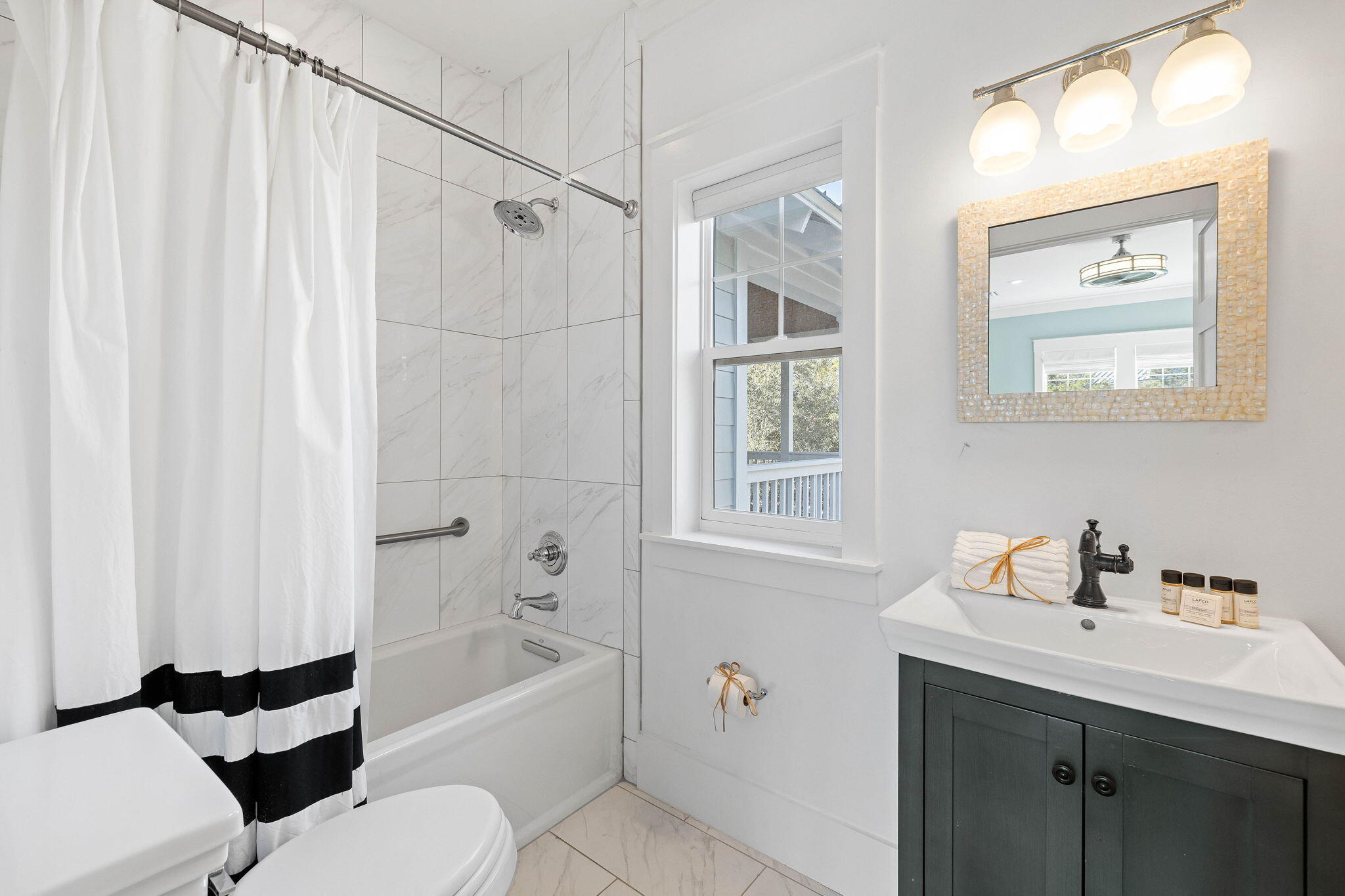 131 Clareon Drive Inlet Beach, FL 32461 - Photo 37 of 62 a bathroom with a sink a toilet and shower
