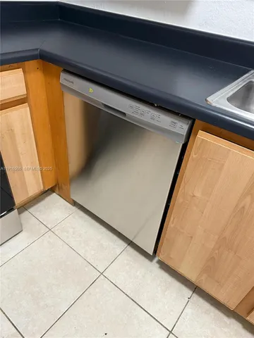 a kitchen with a stove a sink and a microwave