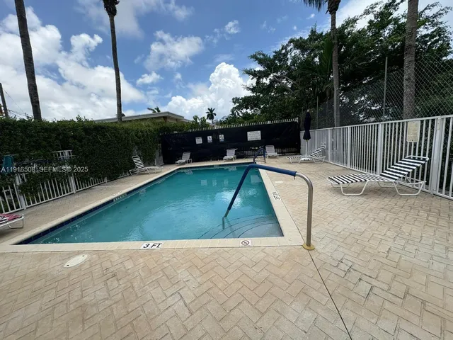 a view of swimming pool with a patio