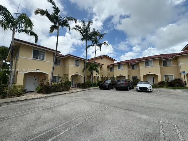 a view of a car park in front of house
