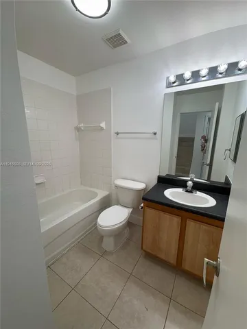 a view of an empty room and a window