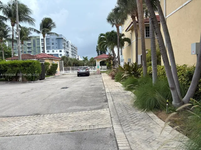 a view of a palm trees in front of a house
