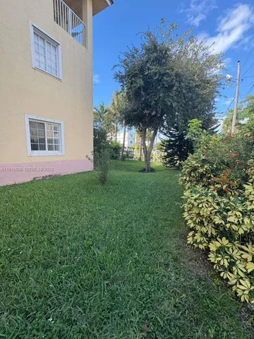 a view of a house with a garden