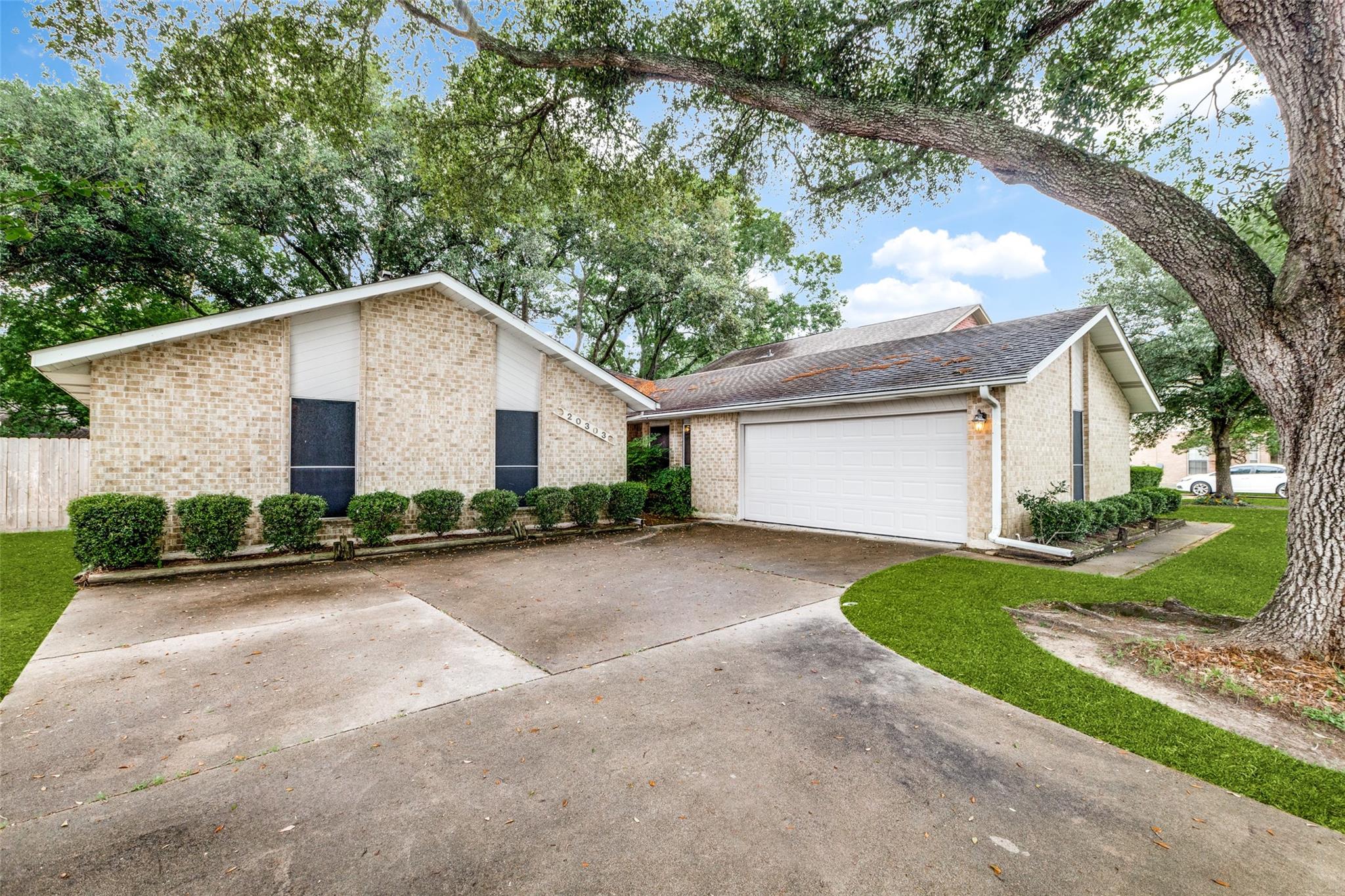 20303 Hampshire Rocks Drive Katy, TX 77450 - Photo 1 of 11 a front view of house with yard and green space