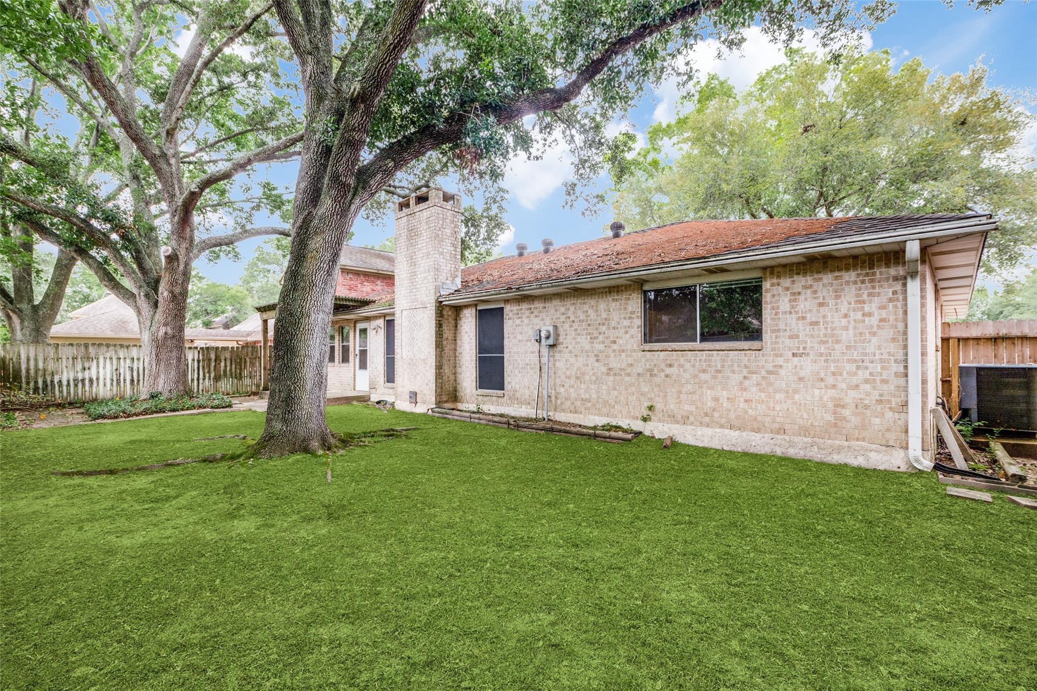 20303 Hampshire Rocks Drive Katy, TX 77450 - Photo 11 of 11 a backyard of a house with seating space