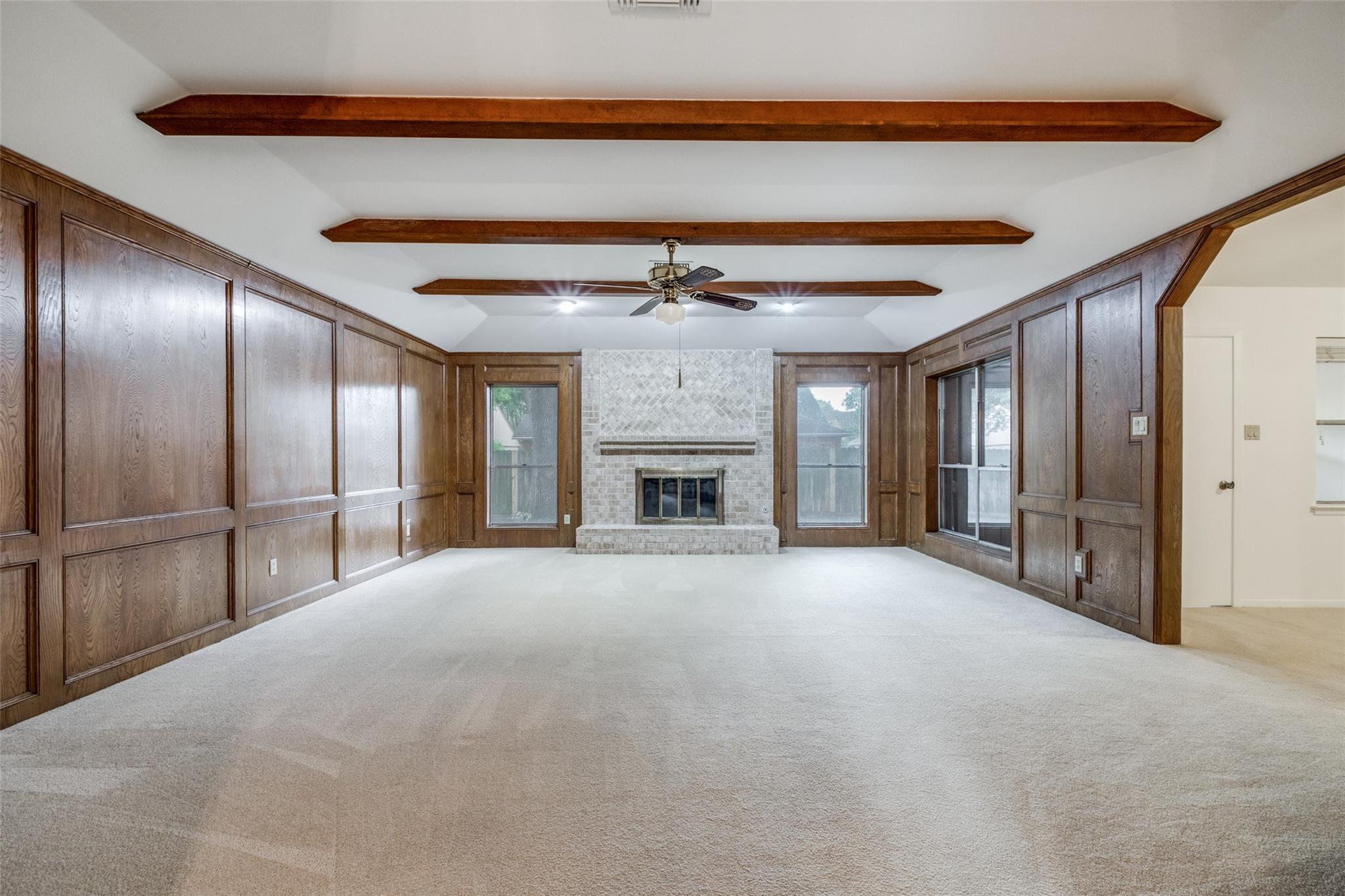 20303 Hampshire Rocks Drive Katy, TX 77450 - Photo 3 of 11 a view of an empty room with a fireplace