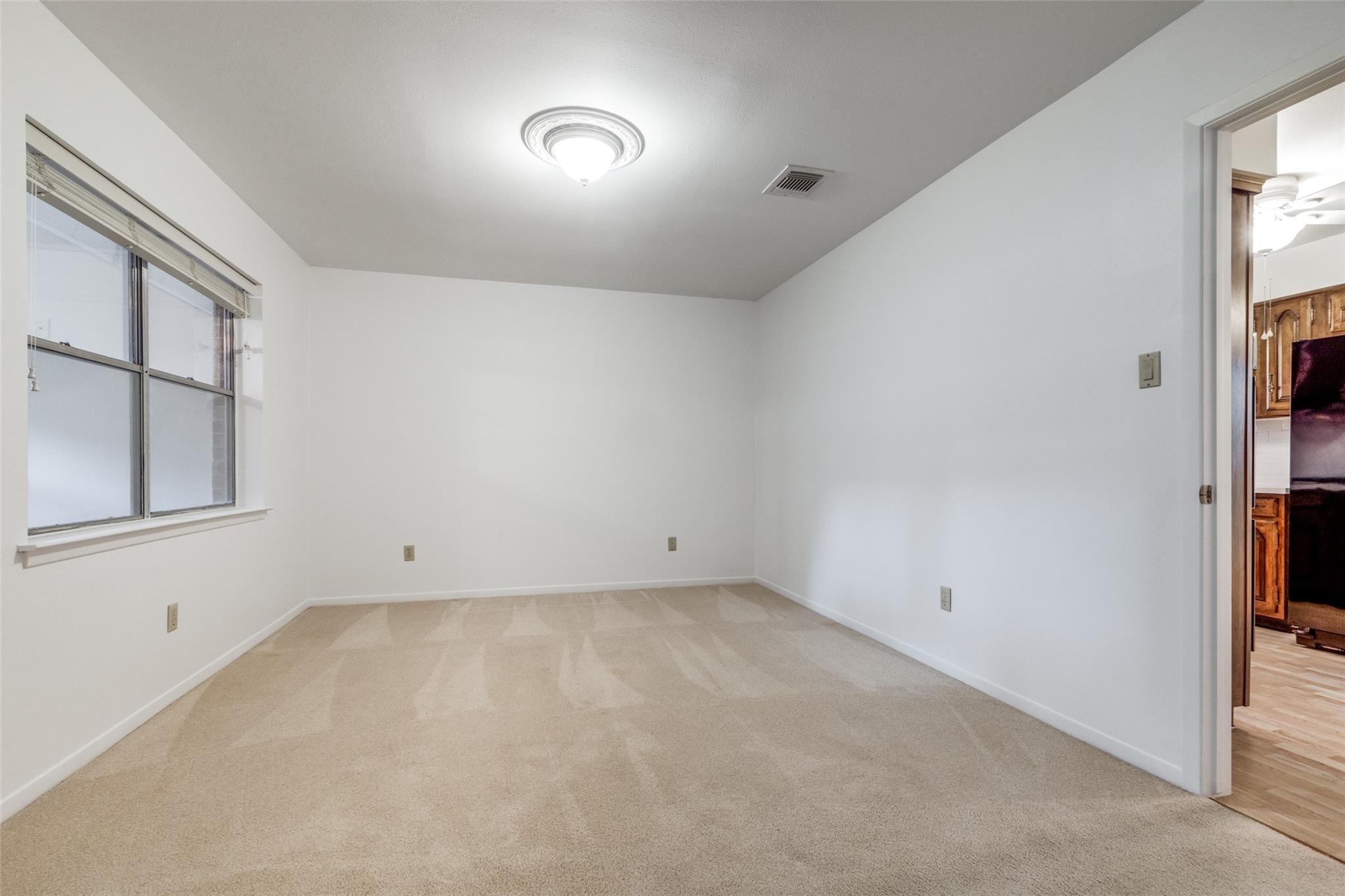 20303 Hampshire Rocks Drive Katy, TX 77450 - Photo 6 of 11 an empty room with windows