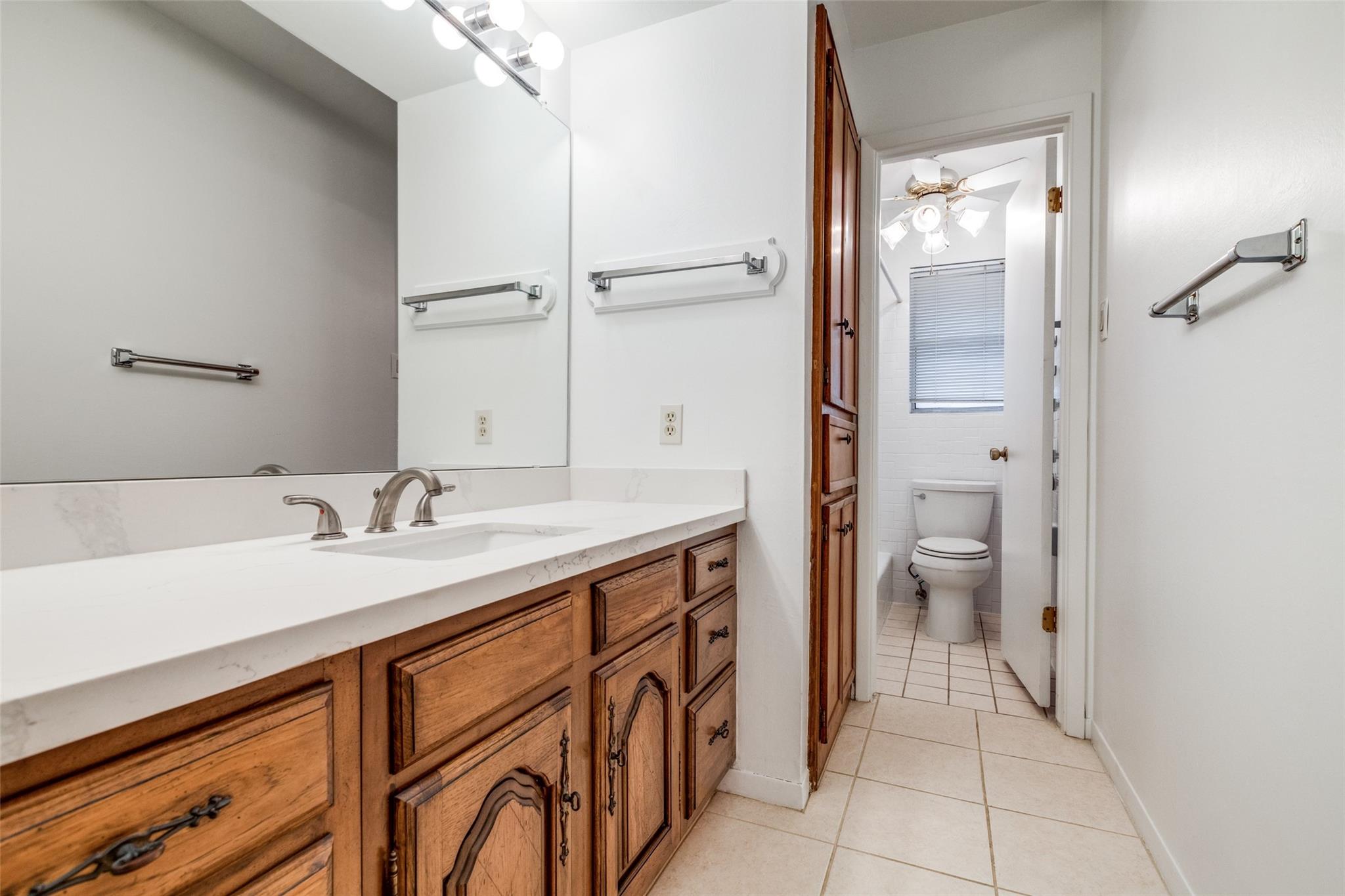 20303 Hampshire Rocks Drive Katy, TX 77450 - Photo 10 of 11 a spacious bathroom with a sink and a mirror