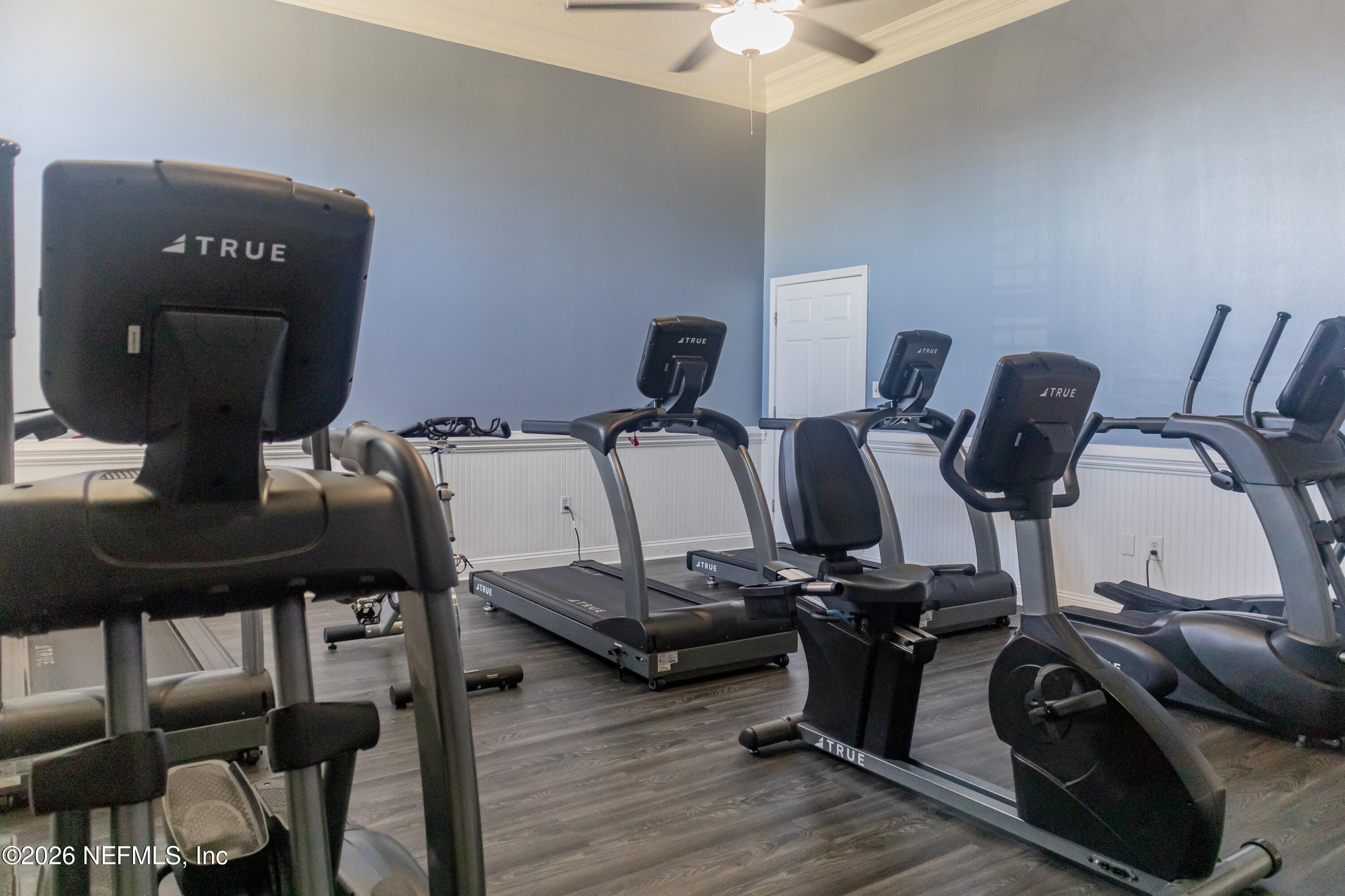 8226 Green Parrot Road, Unit 105 Jacksonville, FL 32256 - Photo 14 of 17 a view of a workspace with furniture and wooden floor