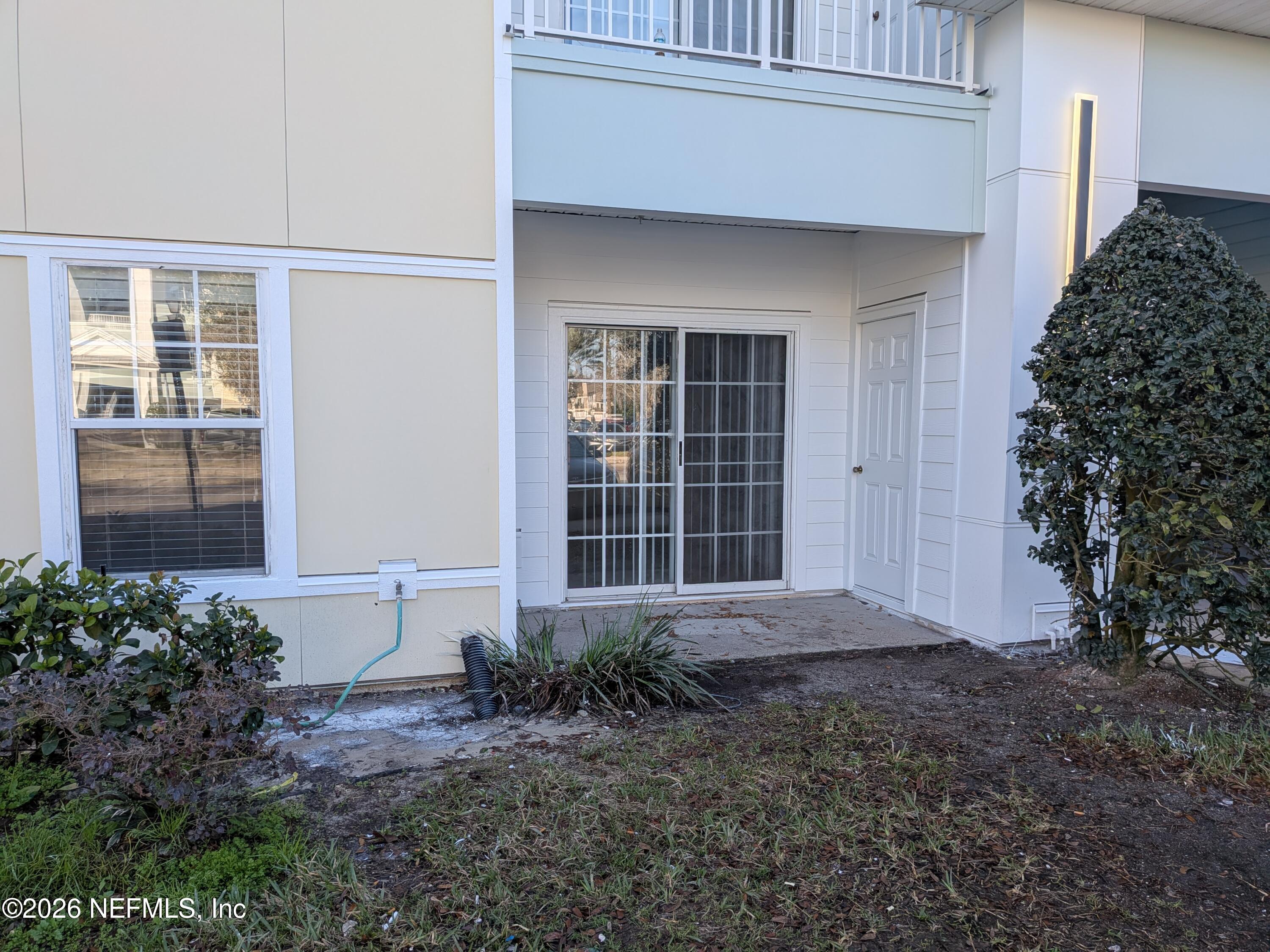 8226 Green Parrot Road, Unit 105 Jacksonville, FL 32256 - Photo 17 of 17 a front view of a house with garden