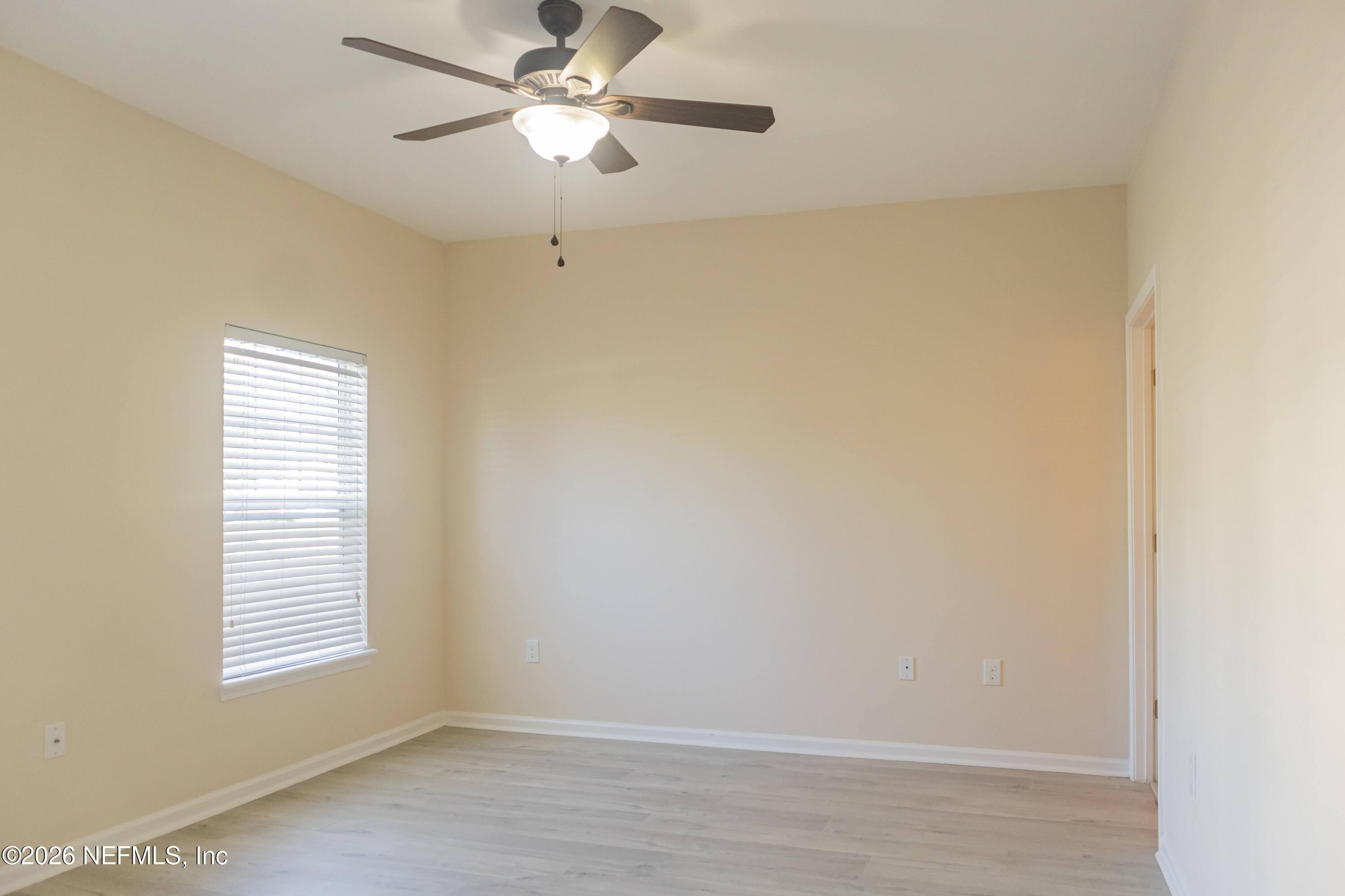 8226 Green Parrot Road, Unit 105 Jacksonville, FL 32256 - Photo 6 of 17 a view of an empty room with a window