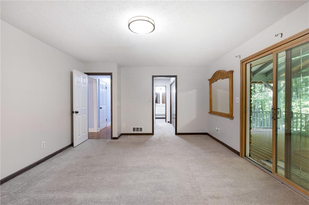 6464 Westerly Way Douglasville, GA 30135 - Photo 11 of 40 an empty room with windows and closet