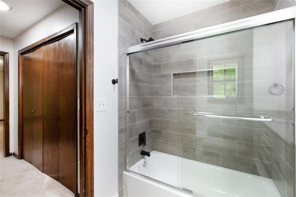 6464 Westerly Way Douglasville, GA 30135 - Photo 13 of 40 a bathroom with a bathtub and a shower