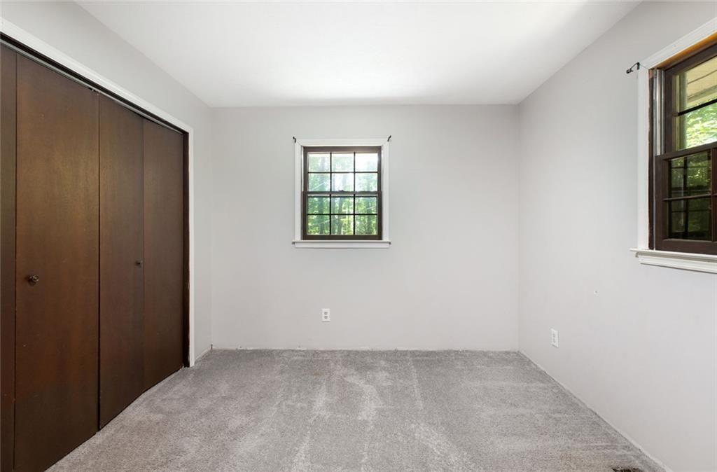 6464 Westerly Way Douglasville, GA 30135 - Photo 18 of 40 an empty room with windows