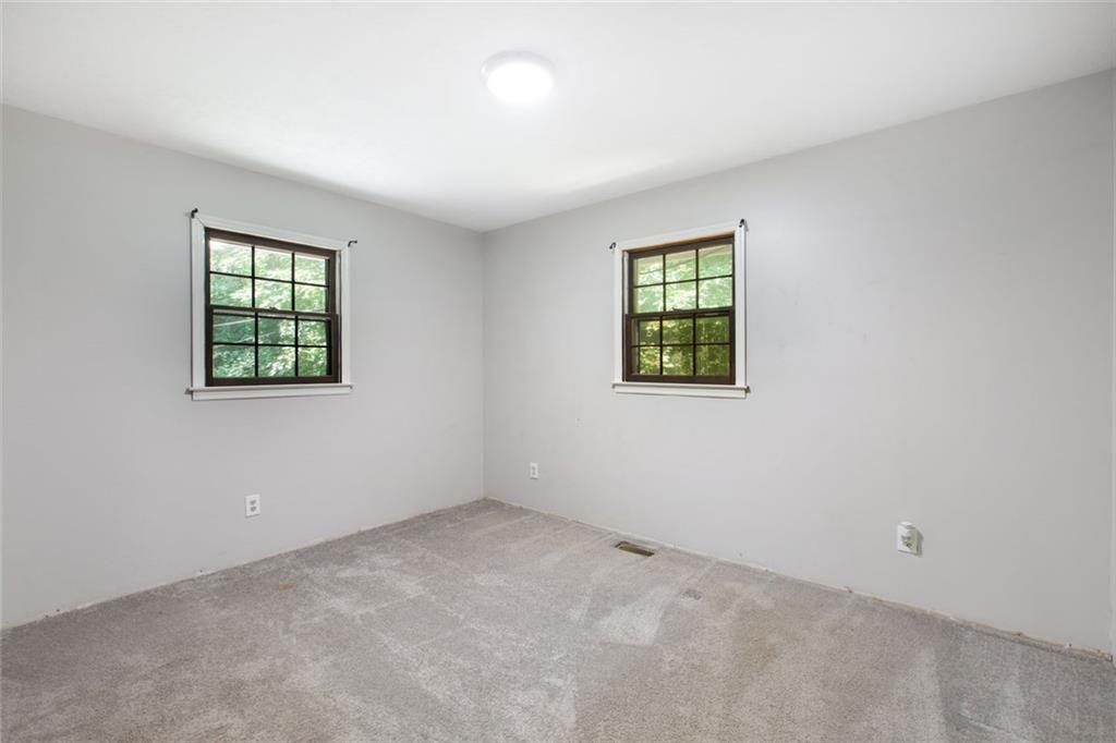 6464 Westerly Way Douglasville, GA 30135 - Photo 19 of 40 an empty room with windows