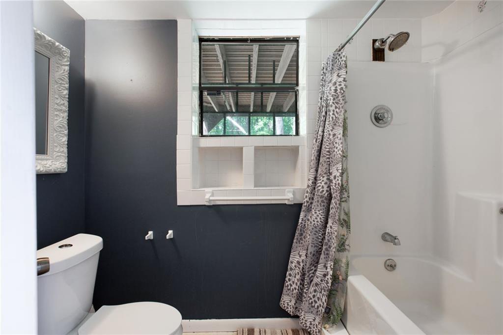 6464 Westerly Way Douglasville, GA 30135 - Photo 27 of 40 a bathroom with a toilet and a shower