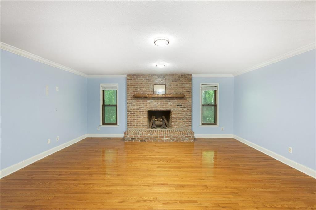 6464 Westerly Way Douglasville, GA 30135 - Photo 3 of 40 a view of empty room with wooden floor and fan