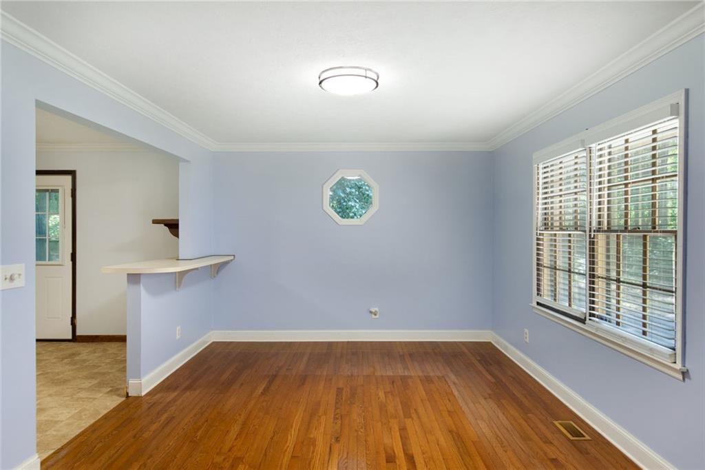 6464 Westerly Way Douglasville, GA 30135 - Photo 5 of 40 wooden floor in an empty room with a window