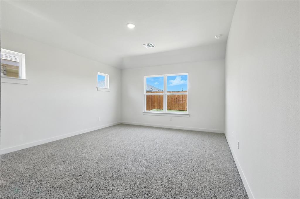 1795 Gleasondale Place Forney, TX 75126 - Photo 13 of 29 Carpeted spare room with baseboards