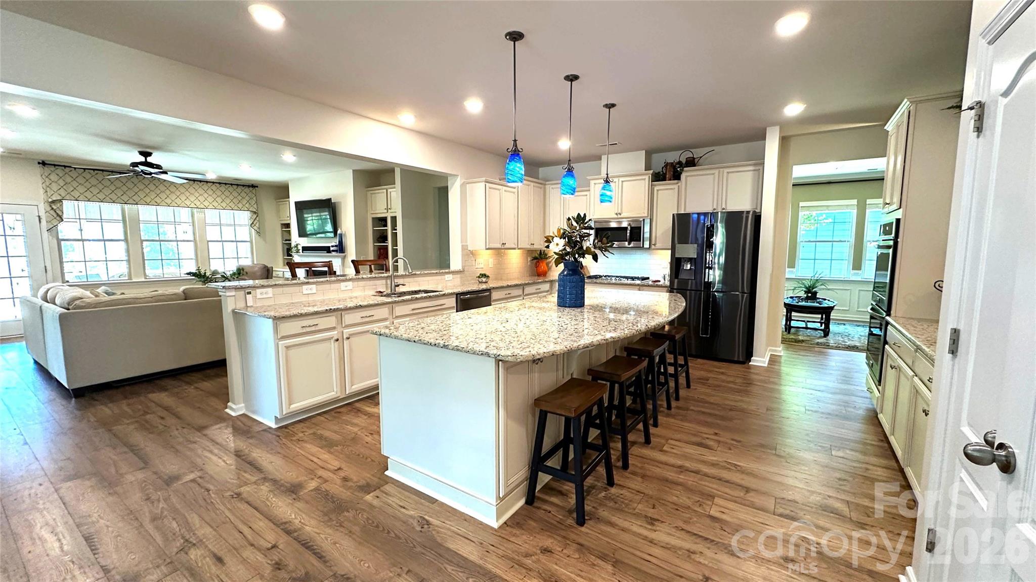 596 Moses Drive Fort Mill, SC 29707 - Photo 11 of 29 a kitchen with counter top space a sink appliances and cabinets