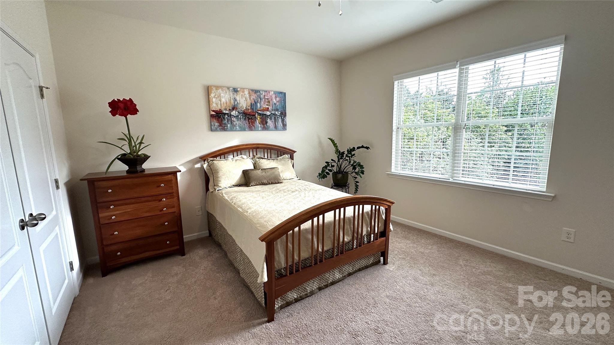 596 Moses Drive Fort Mill, SC 29707 - Photo 16 of 29 a bedroom with a bed and a window