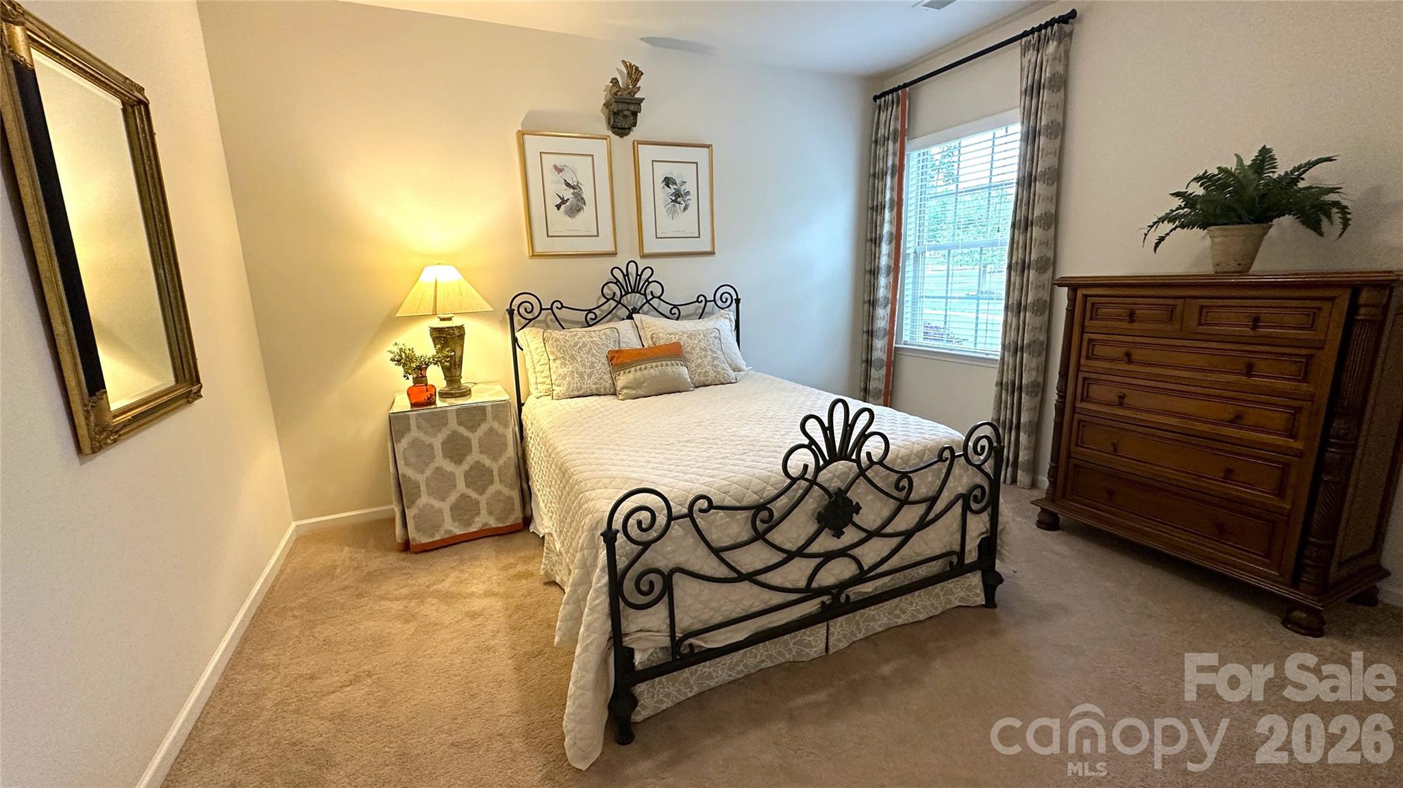 596 Moses Drive Fort Mill, SC 29707 - Photo 17 of 29 a bedroom with a bed and a window