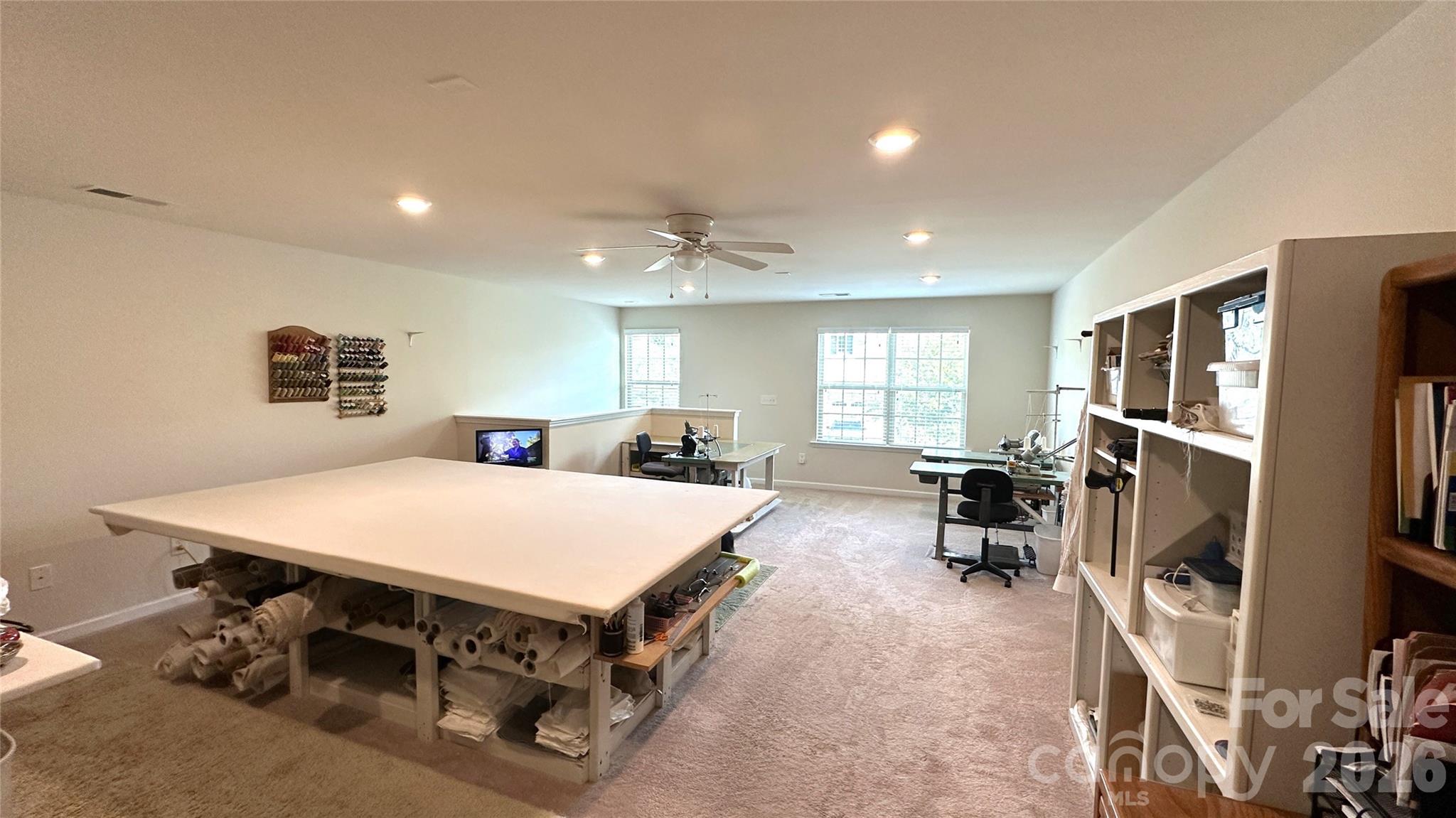 596 Moses Drive Fort Mill, SC 29707 - Photo 20 of 29 a living room with furniture a flat screen tv and a refrigerator
