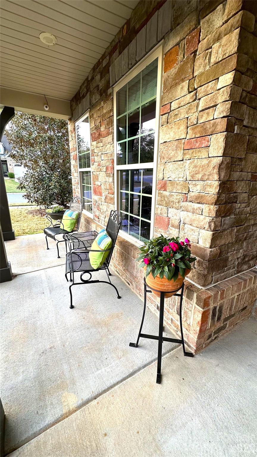 596 Moses Drive Fort Mill, SC 29707 - Photo 2 of 29 a building outdoor space with patio furniture and potted plants