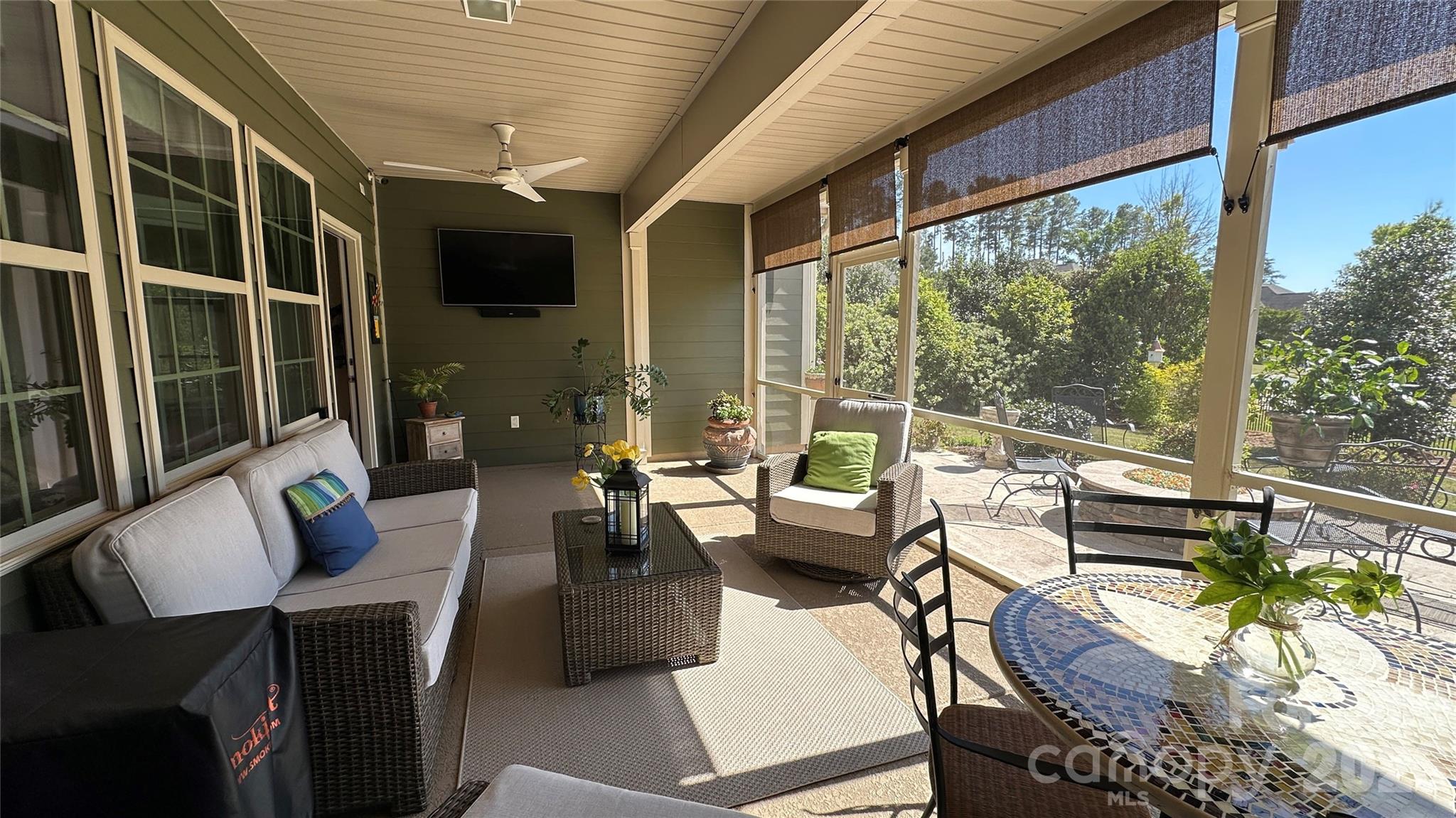 596 Moses Drive Fort Mill, SC 29707 - Photo 23 of 29 a outdoor space with patio the couches and a dining table with garden view