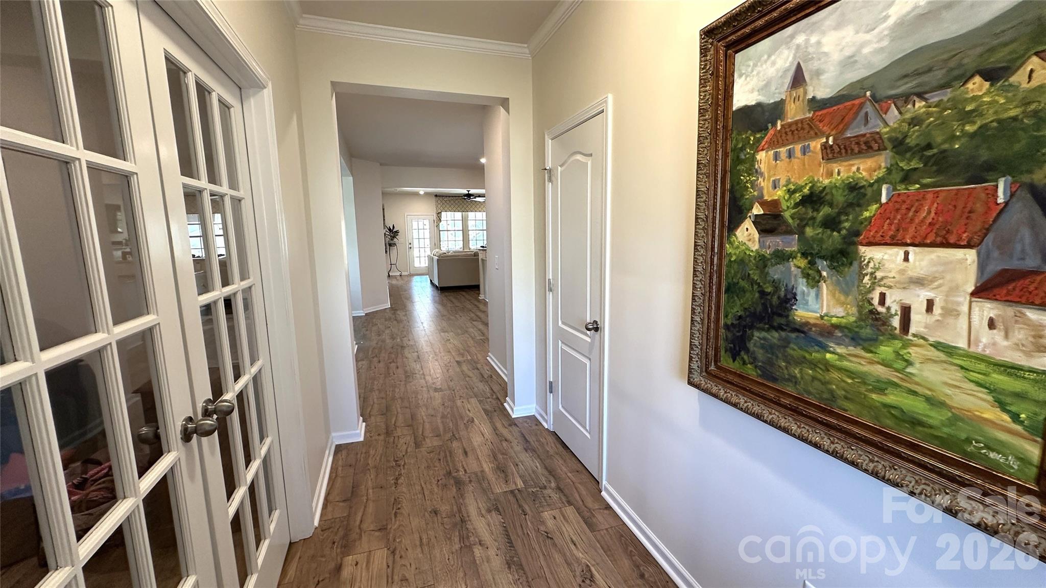 596 Moses Drive Fort Mill, SC 29707 - Photo 3 of 29 a view of a hallway with wooden floor and fence of a house