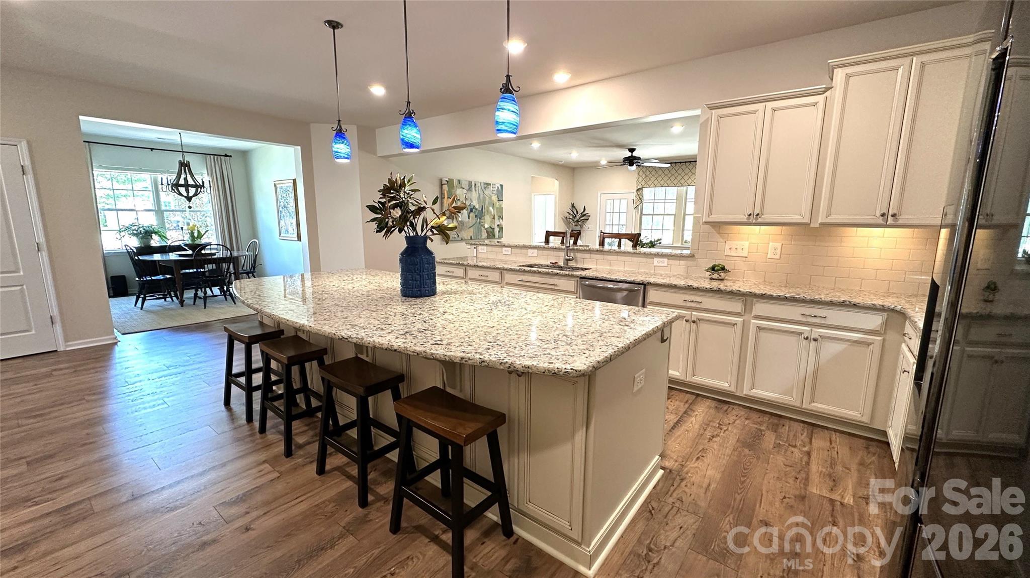 596 Moses Drive Fort Mill, SC 29707 - Photo 6 of 29 a kitchen with a table chairs sink and cabinets