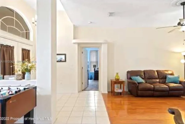 a living room with furniture and a stove