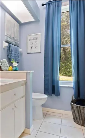 a bathroom with a sink a toilet and tub