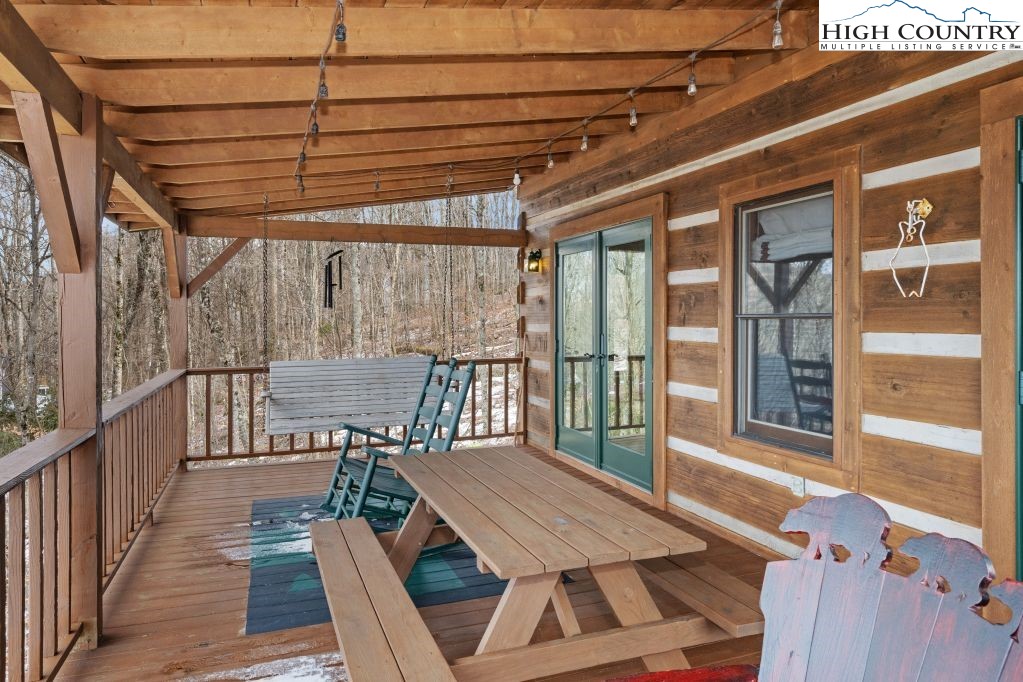 126 Rock Spring Circle Sugar Mountain, NC 28604 - Photo 19 of 29 a view of a patio with wooden floor