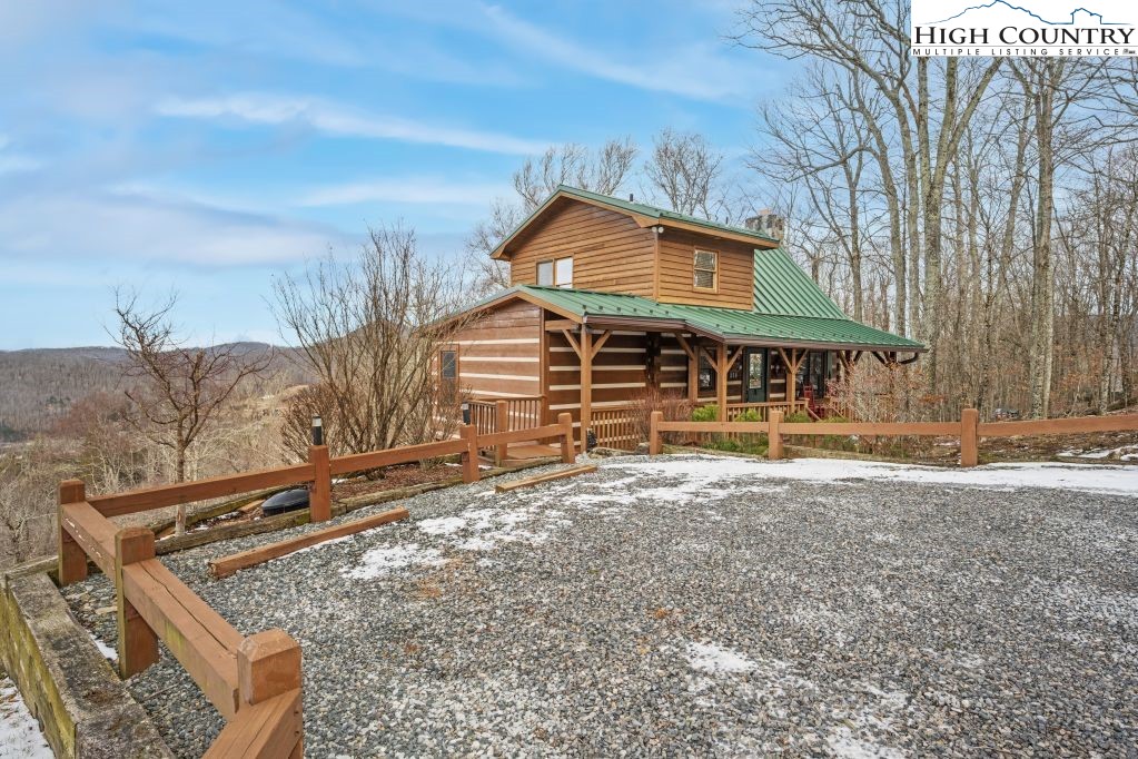 126 Rock Spring Circle Sugar Mountain, NC 28604 - Photo 27 of 29 a front view of a house with a yard