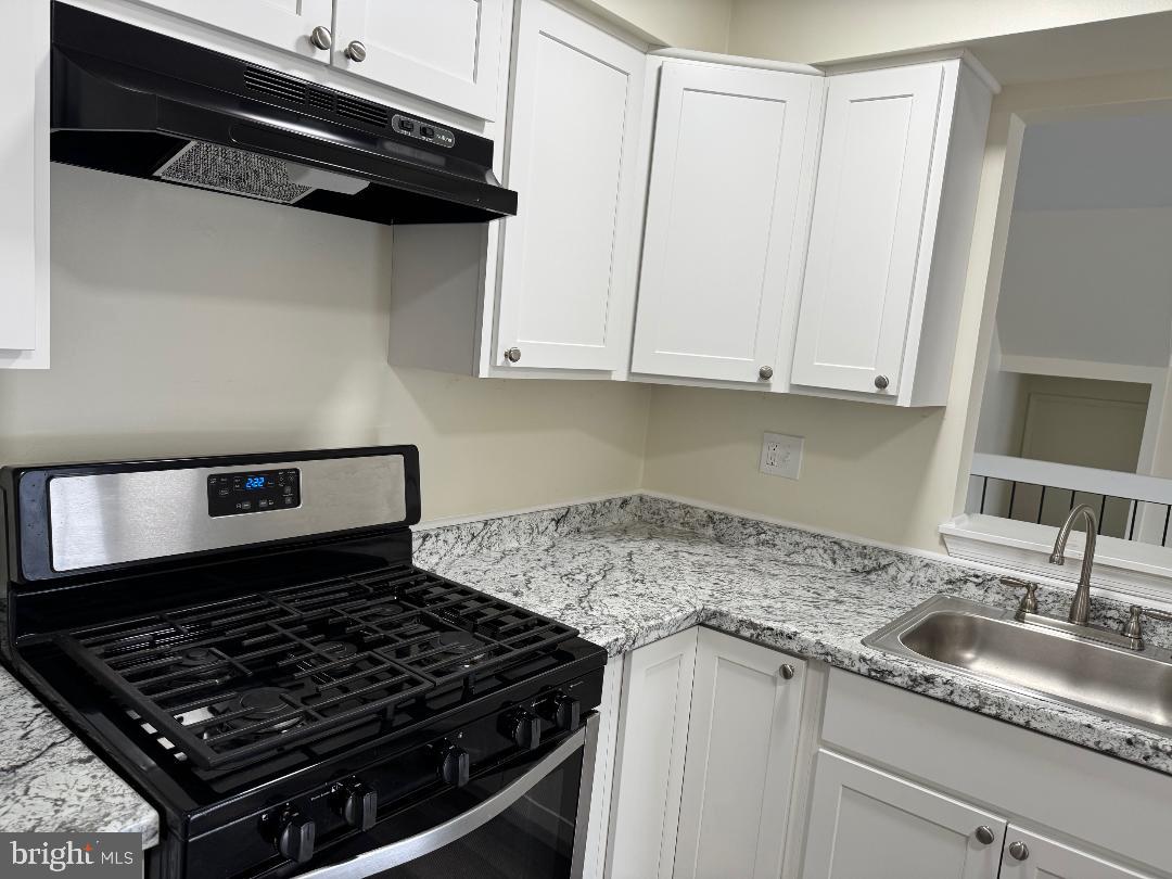 708B Ralston Drive Mount Laurel, NJ 08054 - Photo 13 of 44 a stove top oven sitting inside of a kitchen