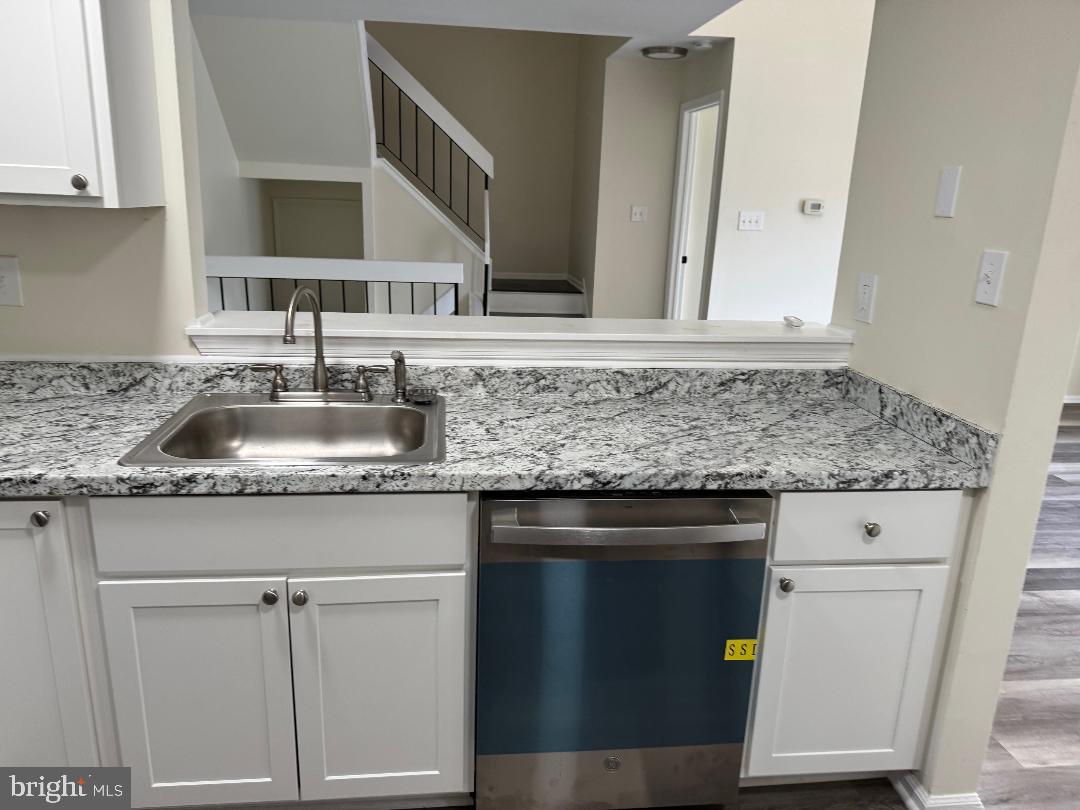 708B Ralston Drive Mount Laurel, NJ 08054 - Photo 14 of 44 a kitchen with granite countertop cabinets sink and stove