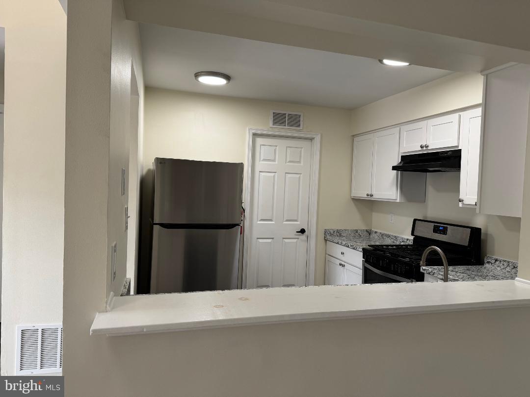 708B Ralston Drive Mount Laurel, NJ 08054 - Photo 16 of 44 a kitchen with a refrigerator and a stove top oven