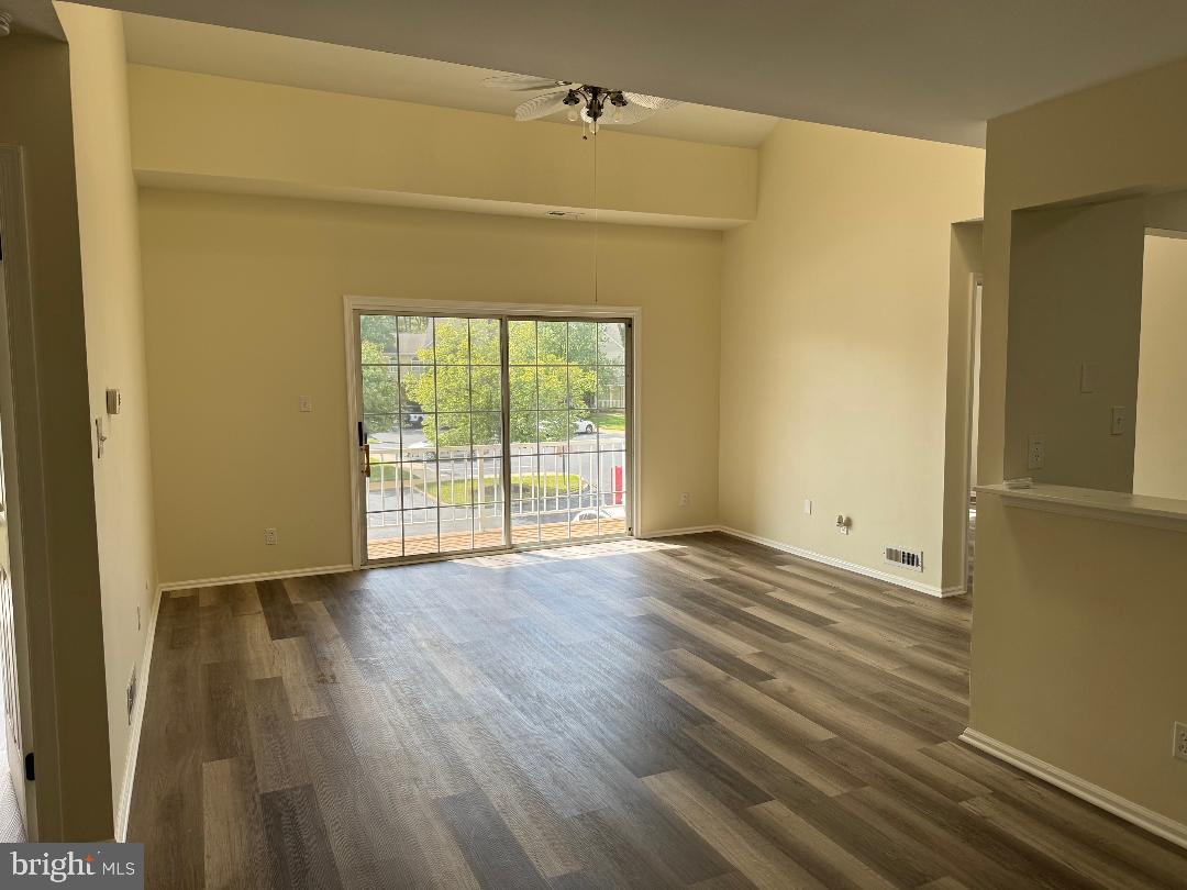 708B Ralston Drive Mount Laurel, NJ 08054 - Photo 7 of 44 a view of an empty room with wooden floor and a window