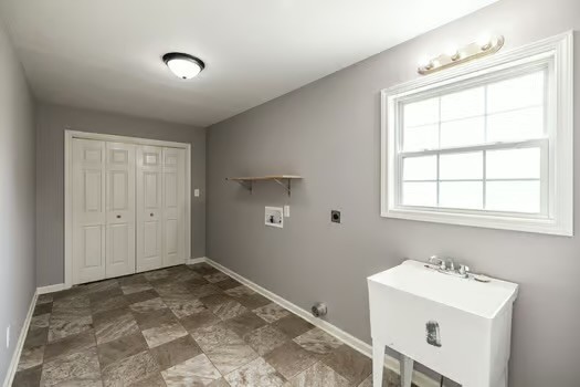 2029 Copper Kettle Circle Pleasant View, TN 37146 - Photo 31 of 58 a bathroom with a sink a window and a mirror