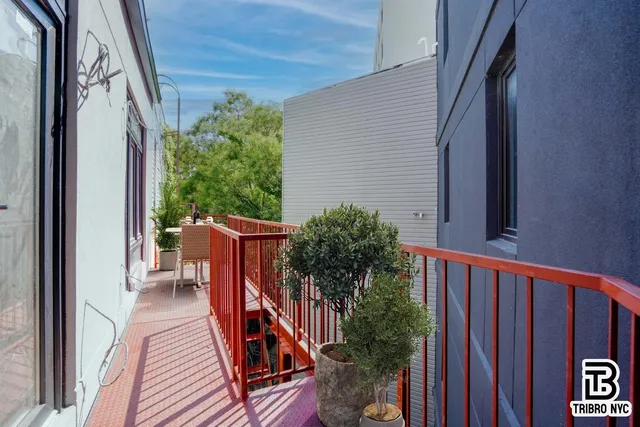 a view of balcony with furniture