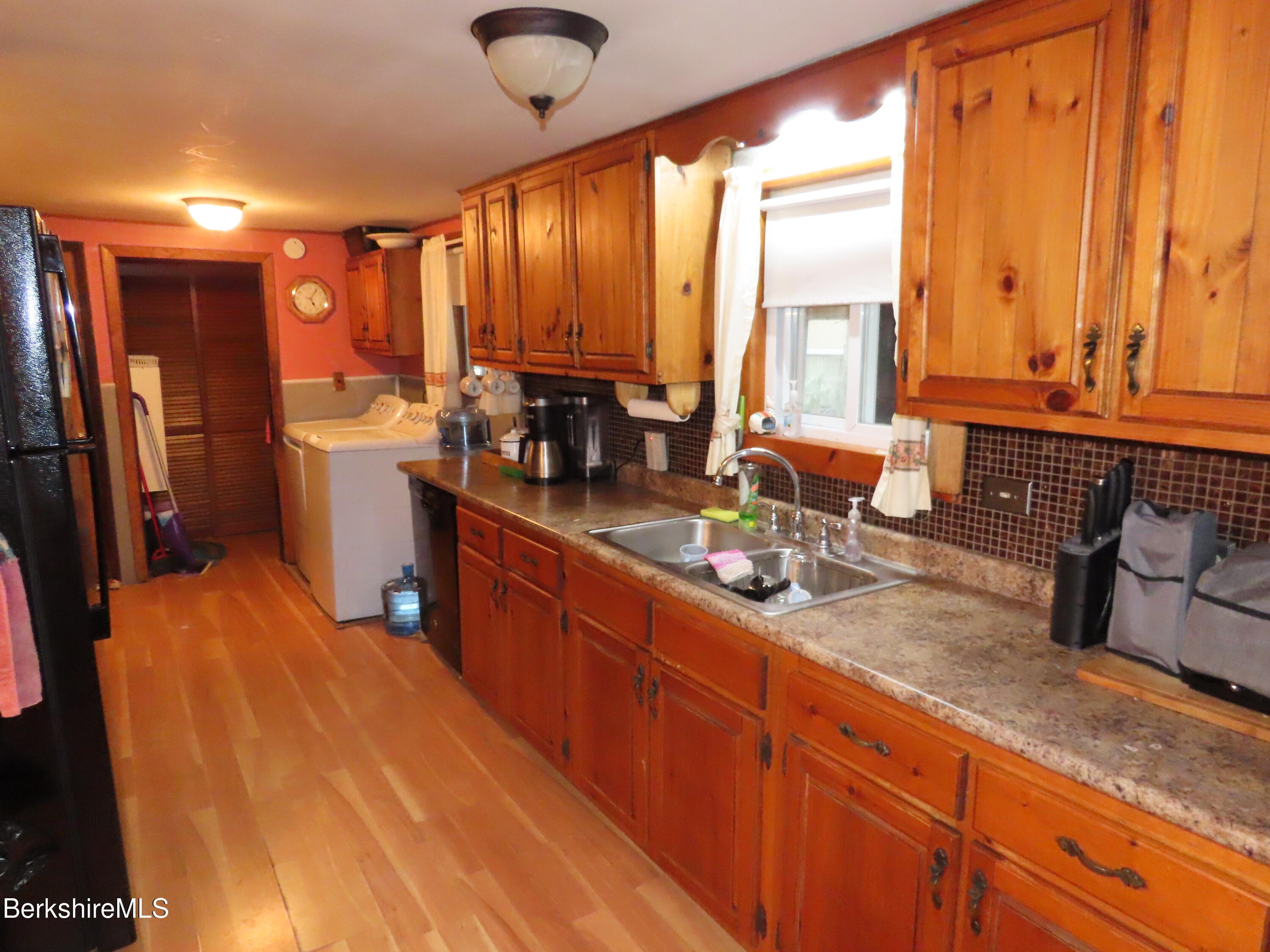 95 E Road Clarksburg, MA 01247 - Photo 4 of 28 a kitchen with large windows and refrigerator