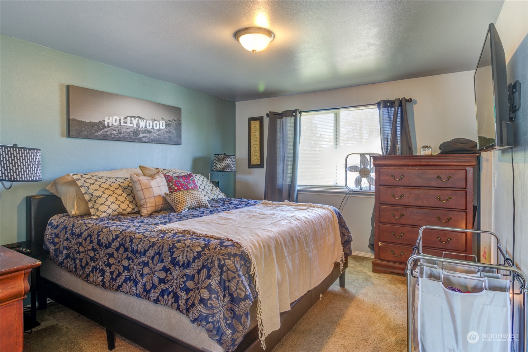 1663 South 48th Street Tacoma, WA 98408 - Photo 11 of 25 a bedroom with a bed and a dresser