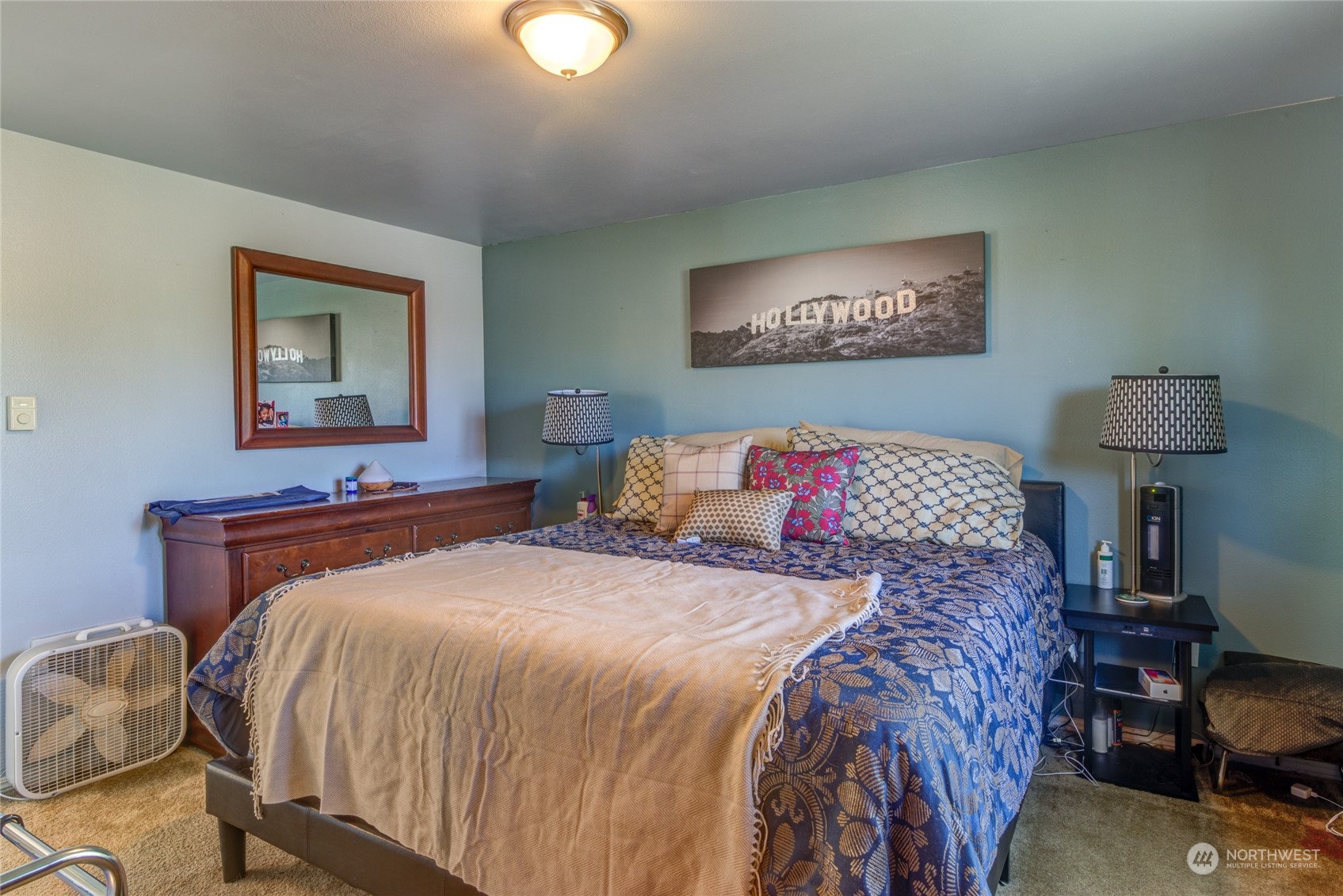 1663 South 48th Street Tacoma, WA 98408 - Photo 12 of 25 a bedroom with a bed and a lamp on table