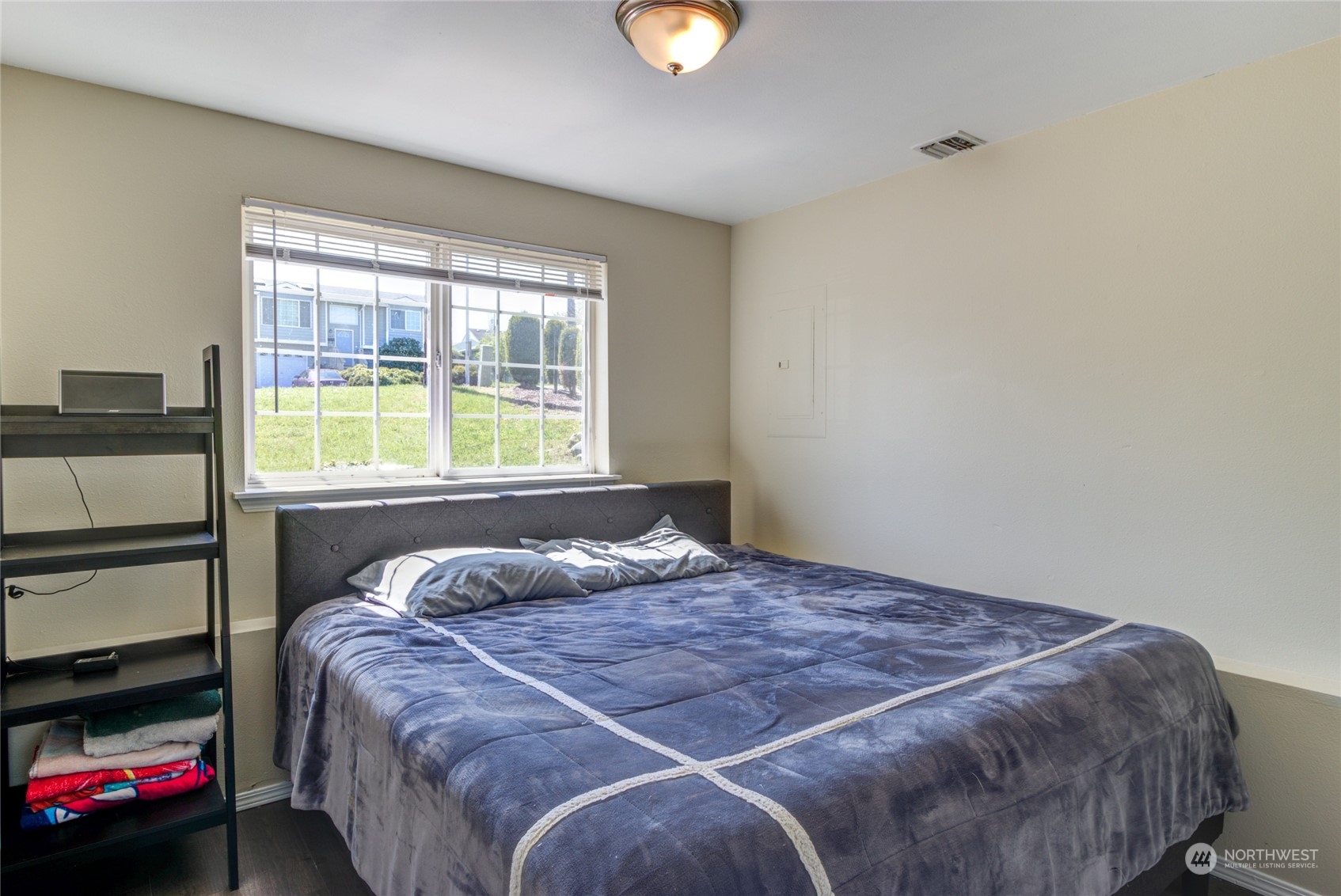 1663 South 48th Street Tacoma, WA 98408 - Photo 14 of 25 a bedroom with a bed and a window