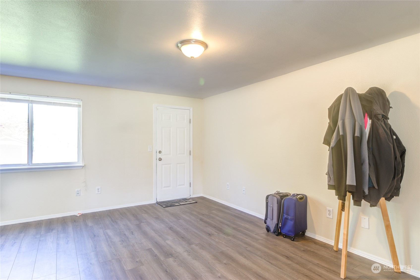 1663 South 48th Street Tacoma, WA 98408 - Photo 19 of 25 a view of a room with wooden floor and a window