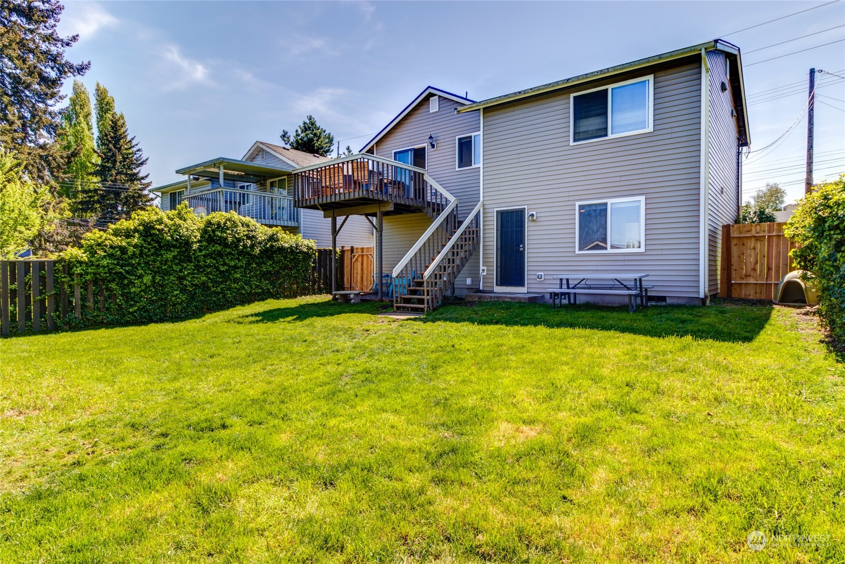 1663 South 48th Street Tacoma, WA 98408 - Photo 21 of 25 a front view of a house with a yard