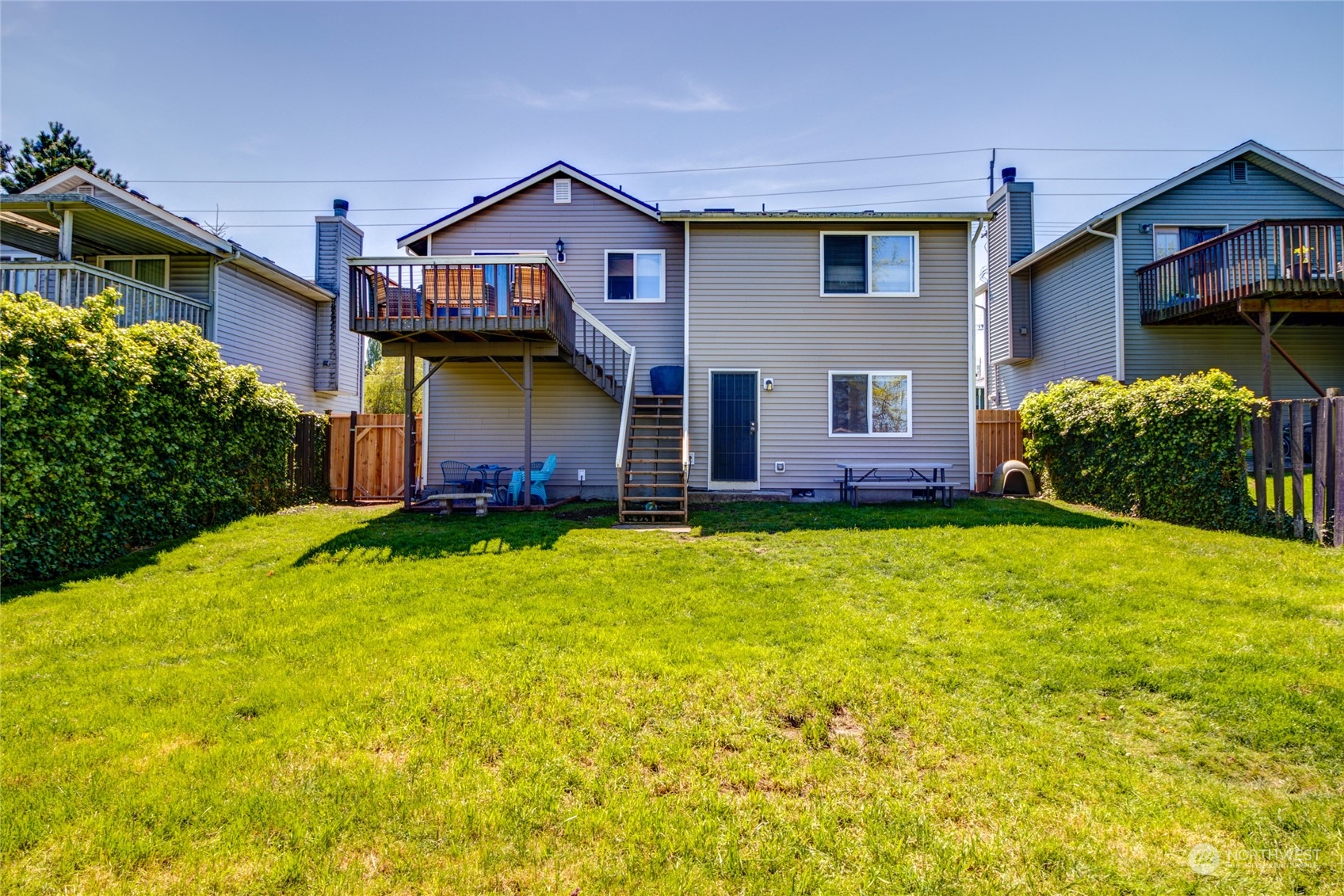 1663 South 48th Street Tacoma, WA 98408 - Photo 22 of 25 a front view of a house with garden