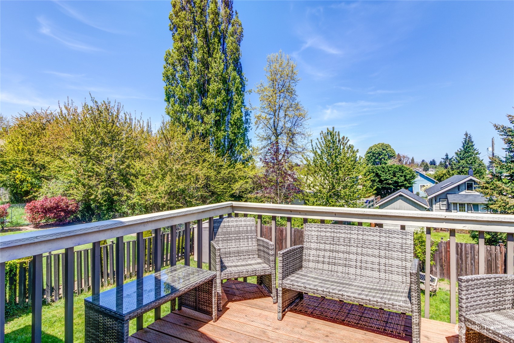 1663 South 48th Street Tacoma, WA 98408 - Photo 25 of 25 a view of a balcony with wooden floor and outdoor seating