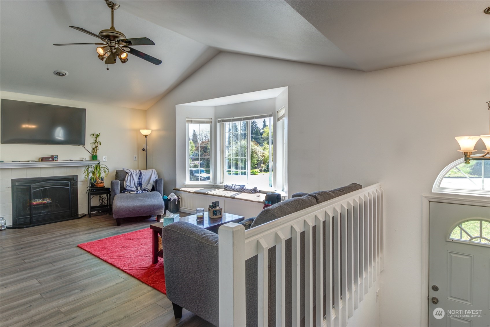 1663 South 48th Street Tacoma, WA 98408 - Photo 9 of 25 a bed room with furniture and a fireplace